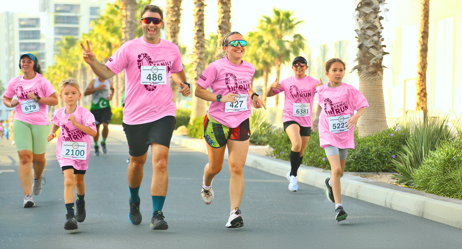 Families running in pink Spinneys Family Run T-shirts